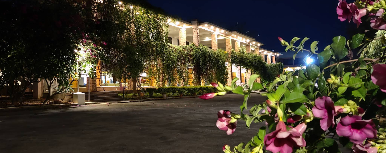 Landscaped gardens and resort buildings at Kanthi Resorts luxury hotel near Badami, Karnataka